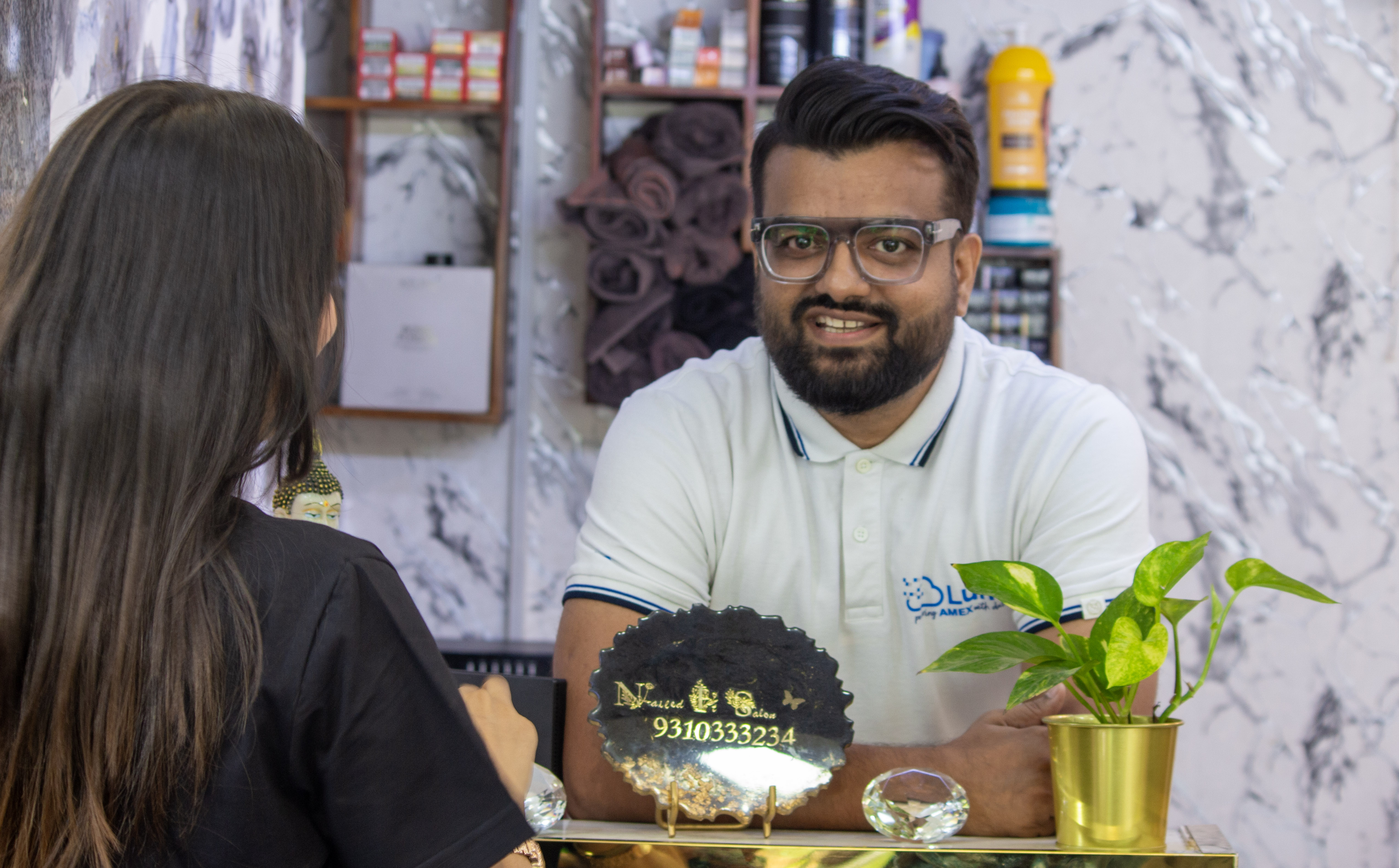 Welcoming reception at Nailed It Salon Delhi NCR — marble interiors and professional staff